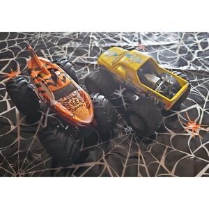 Set of Monster trucks; HOT WHEELS and SUZUKI